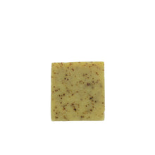Load image into Gallery viewer, A large yellow square looking soap with brown speckles running through it