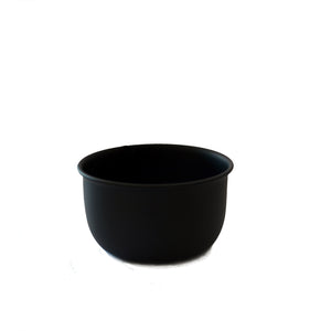 A small black bowl on a white background